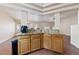 Granite breakfast bar with wood cabinets and tile floor at 8212 Bolingbrook Ave, Las Vegas, NV 89149