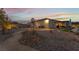 Landscaped backyard with lighting and pathway at 8750 Lutts St, Las Vegas, NV 89131