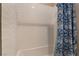 Clean bathroom with a shower/tub combo and patterned shower curtain at 8750 Lutts St, Las Vegas, NV 89131