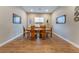 Modern dining room with hardwood floors and a wood dining table at 8750 Lutts St, Las Vegas, NV 89131