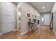 Bright and spacious entryway with wood floors and half bath at 8750 Lutts St, Las Vegas, NV 89131