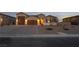 Three-car garage and attractive facade with desert landscaping at 8750 Lutts St, Las Vegas, NV 89131