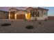 Stunning curb appeal with a large driveway and desert landscaping at 8750 Lutts St, Las Vegas, NV 89131