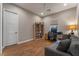 Home office with wood floors, built-in shelving, and a desk at 8750 Lutts St, Las Vegas, NV 89131