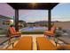 Relaxing patio with lounge chairs and a view of the pool and mountains at 8750 Lutts St, Las Vegas, NV 89131