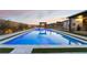 Luxury pool and spa with LED lighting, landscaped surrounds, and pergola at 8750 Lutts St, Las Vegas, NV 89131