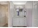 Bathroom with white vanity, marble countertop, and large mirror at 9330 Golden Timber Ln, Las Vegas, NV 89117