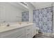 Clean bathroom with double sinks, updated vanity, and shower/tub combo at 9330 Golden Timber Ln, Las Vegas, NV 89117