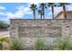 Stone entrance sign for Apache Springs Townhomes community at 9330 Golden Timber Ln, Las Vegas, NV 89117