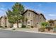 Two-story townhome with attractive landscaping and a two-car garage at 9330 Golden Timber Ln, Las Vegas, NV 89117