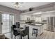 Open kitchen with an island, white cabinets and stainless steel appliances at 9330 Golden Timber Ln, Las Vegas, NV 89117