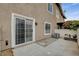 Private patio with concrete flooring, sliding door access, and a small yard at 9330 Golden Timber Ln, Las Vegas, NV 89117