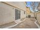 Small backyard with gravel landscaping and sliding glass door access at 947 Cantabria Heights Ave, Las Vegas, NV 89183