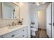 Modern bathroom with white vanity, quartz countertop, and updated fixtures at 947 Cantabria Heights Ave, Las Vegas, NV 89183