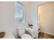 Clean bathroom with toilet and window, updated fixtures and flooring at 947 Cantabria Heights Ave, Las Vegas, NV 89183