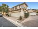 Two-story house with attached garage and driveway at 947 Cantabria Heights Ave, Las Vegas, NV 89183