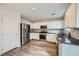 Modern kitchen with stainless steel appliances and granite countertops at 947 Cantabria Heights Ave, Las Vegas, NV 89183