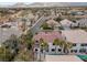 This aerial view showcases the home's backyard pool, landscaping, and proximity to the golf course at 99 Teton Pines Dr, Henderson, NV 89074