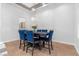 Cozy dining area with modern lighting, tile flooring, and a table set for an intimate meal at 99 Teton Pines Dr, Henderson, NV 89074