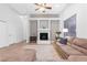 Cozy living room featuring a fireplace, comfortable seating, and tile flooring at 99 Teton Pines Dr, Henderson, NV 89074