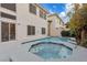 This backyard features a beautiful pool and spa combination with sleek, modern design at 99 Teton Pines Dr, Henderson, NV 89074