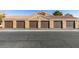 Row of attached garages with brown doors and tan exterior at , Las Vegas, NV 89147