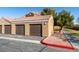 Attached garages with brown doors and landscaping at , Las Vegas, NV 89147