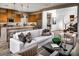 Open living room with white couch and large windows at 10119 Sequoia Glen Ave, Las Vegas, NV 89166