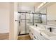 Modern bathroom with marble vanity and glass shower at 10282 Country Flats Ln, Las Vegas, NV 89135