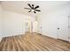 Neutral bedroom features fan, wood floors, and neutral walls at 10282 Country Flats Ln, Las Vegas, NV 89135