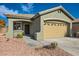 House exterior showcasing a two-car garage and front entrance at 10282 Country Flats Ln, Las Vegas, NV 89135