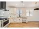 Modern kitchen featuring white cabinets and copper appliances at 10282 Country Flats Ln, Las Vegas, NV 89135