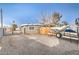 Gravel driveway with boat and trailer at 108 S Mallard St, Las Vegas, NV 89107