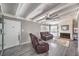 Living room with hardwood floors, fireplace, and ceiling fan at 108 S Mallard St, Las Vegas, NV 89107