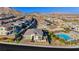 Stunning aerial view of a house with community pool in the background at 11700 Belorado Ave, Las Vegas, NV 89138