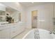 Bright bathroom boasts double sinks and a freestanding bathtub at 11700 Belorado Ave, Las Vegas, NV 89138