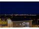 Night view of community restroom with city skyline in background at 11700 Belorado Ave, Las Vegas, NV 89138