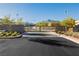 Gated community entrance with landscaping and mountain views at 11700 Belorado Ave, Las Vegas, NV 89138