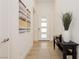 Bright and airy entryway with wood-look flooring and console table at 11700 Belorado Ave, Las Vegas, NV 89138