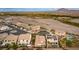 Aerial view of houses, a street, and a desert landscape at 1172 Via Della Costrella, Henderson, NV 89011