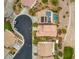 Aerial view of a house and neighborhood with a pool at 1172 Via Della Costrella, Henderson, NV 89011