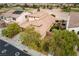 A beautiful aerial view reveals this single-story home's well-maintained landscaping and proximity to the golf course at 1172 Via Della Costrella, Henderson, NV 89011