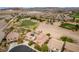 Expansive aerial view of the community highlighting its proximity to the golf course and desert landscape at 1172 Via Della Costrella, Henderson, NV 89011