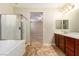 Bright, tile-floored bathroom features double sinks and separate tub and shower at 1172 Via Della Costrella, Henderson, NV 89011