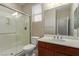 Bathroom with a shower featuring sliding glass doors, toilet and a single sink vanity at 1172 Via Della Costrella, Henderson, NV 89011