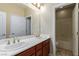 Well-lit bathroom features double sinks, spacious countertops and separate toilet/shower room at 1172 Via Della Costrella, Henderson, NV 89011