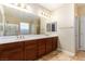 Bathroom features a large vanity, double sinks, and a shower at 1172 Via Della Costrella, Henderson, NV 89011