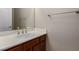 Bathroom featuring a single sink vanity with cabinet and a decorative mirror at 1172 Via Della Costrella, Henderson, NV 89011