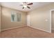 Bedroom with neutral carpet, paint, and a window with blinds at 1172 Via Della Costrella, Henderson, NV 89011