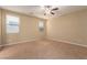 Spacious bedroom featuring neutral walls, plush carpeting, and a ceiling fan at 1172 Via Della Costrella, Henderson, NV 89011